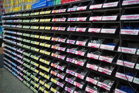 Rows of labelled small-parts drawers holding screws, bolts and fixings