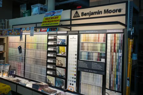 The Benjamin Moore colour centre display with racks of colour cards and sample brochures