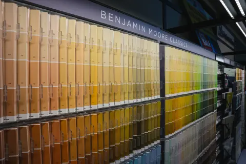 The Benjamin Moore Classics colour chip wall running the length of the paint department