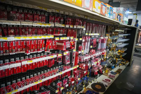A wall of packaged drill bits, driver bits and saw blades in the tool aisle