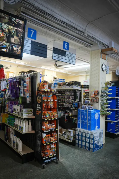 The store interior with numbered aisle signs hanging above the displays