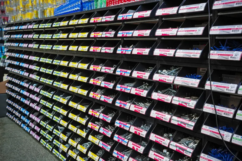 Rows of labelled small-parts drawers holding screws, bolts and fixings